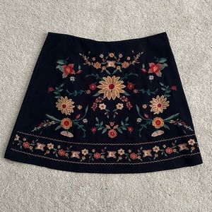 Francesca’s navy embroidered mini skirt